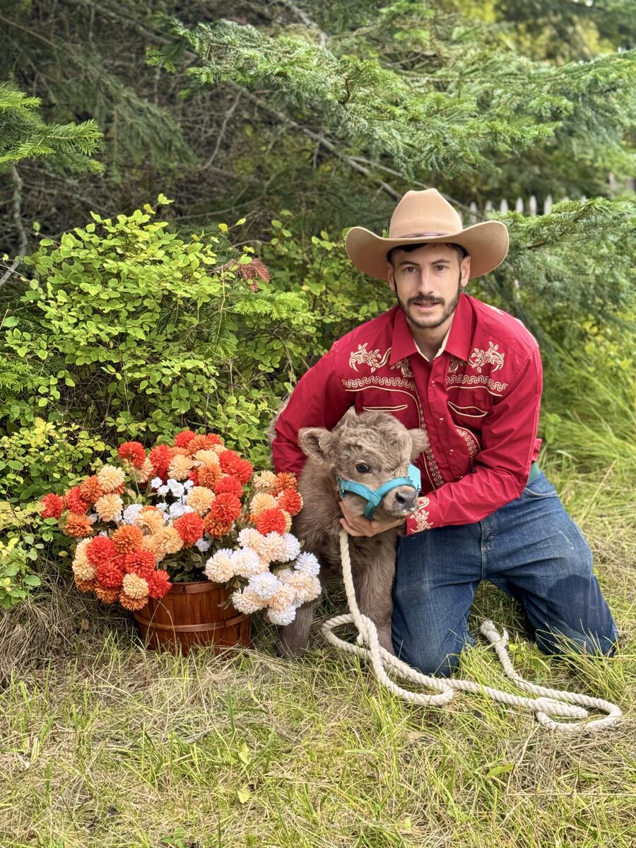 Spencer with a Mini Highland calf